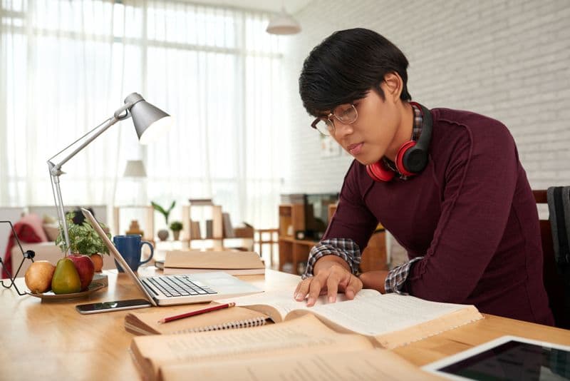 Secondary school student studying with a home tutor in Singapore