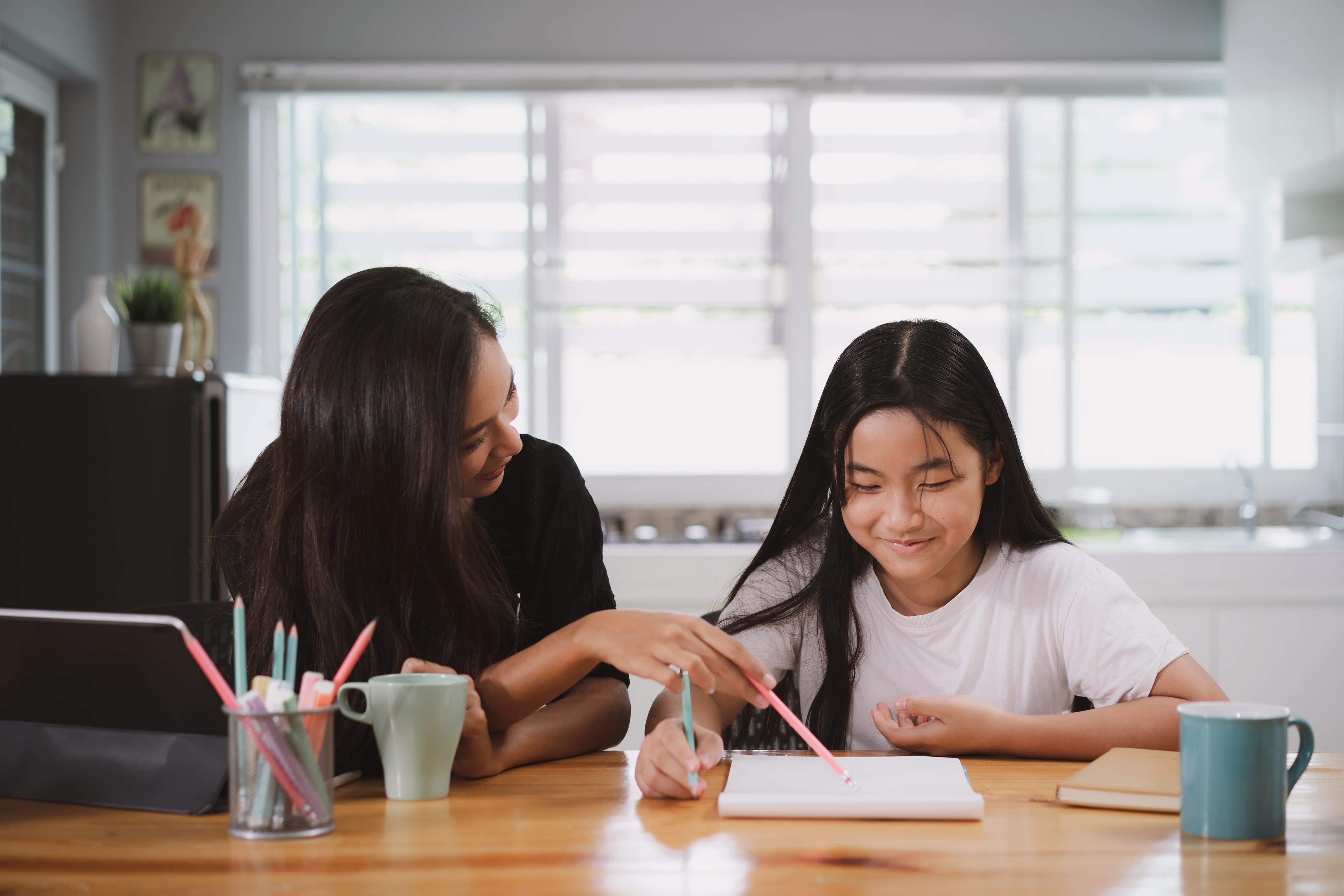 Home tutor helping student with studies in Singapore
